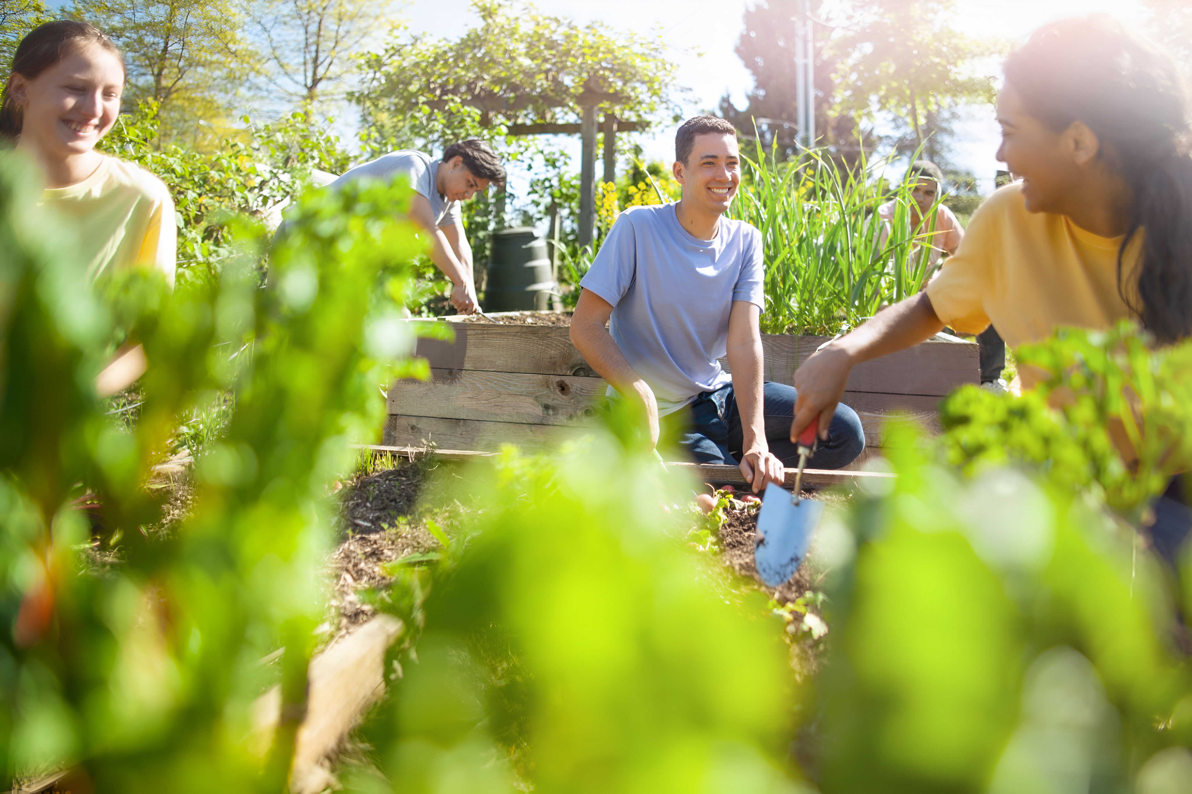 multiracial-group-young-men-young-women-students-plant-together-smiling
